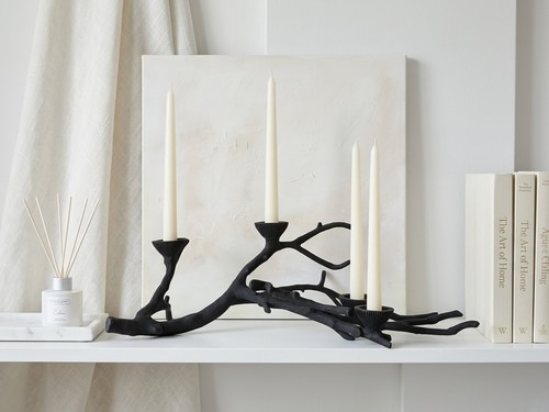 Eclectic cast iron candle