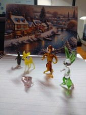 An old collection of small glass animals in various colours