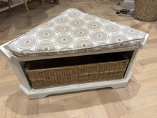 White Wooden Corner Unit With Wicker Basket And Cushion