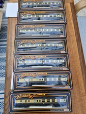 Seven boxed OO gauge Mainline BR (WR) Mk1 coaches in Chocolate and cream livery