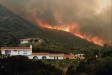 505075 Home Above Wild Animal Park Threatened By Flames A4 Photo Print