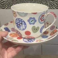 HERON CROSS POTTERY JUMBO CUP AND SAUCER QUIRKY PATTERN BUTTONS MULTICOLOURED