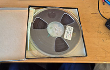 A 7" reel to reel spool only. Some reels may have old  tape on them