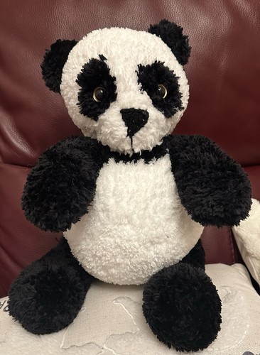 Hand knitted panda - hand, bear