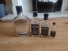 4 Jack Daniels Empty Bottles.