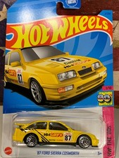HOT WHEELS 1987 FORD SIERRA COSWORTH. 2023 KROGER EXCLUSIVE YELLOW ON CARD