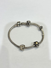 GENUINE PANDORA BRACELET WITH 4 CHARMS  (19CMS)