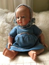 Antique celluloid baby doll by French firm Petitcollin, 1920's with glass eyes