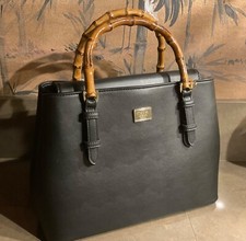 Stunning Bamboo handled Handbag with Leopard print lining and shoulder strap.