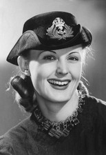 Woman poses in a Wrens hat