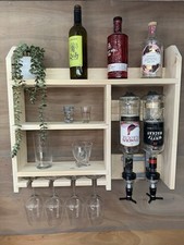 Wall mounted optics bar