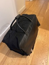 Vintage Gucci Two Way Wheeled Travel Bag In Black Leather