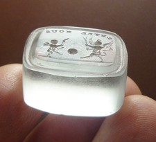Clear Glass Intaglio Seal Of The Devil And Cupid Making A Football Of The World.