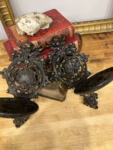 Pair cast iron cherub - pair,