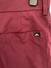 J LINDEBERG GOLF TROYAN MICRO STRETCH BURGUNDY WATER REPELLENT TROUSERS 32/34