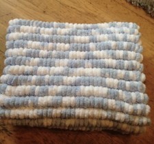 hand knitted blue and white Pom pom blanket approx 22inch x 32 inch brand new
