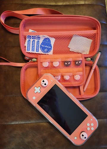 Nintendo switch lite coral - nintendo,