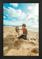 BOY WITH DOG ON THE BEACH