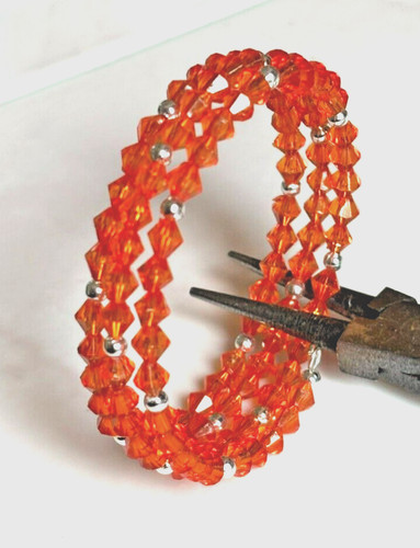 Coil orange coloured bicone - coil,