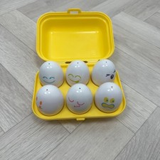 Tomy squeaky eggs toy matching