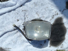 Front headlight for a Megelli supermotad