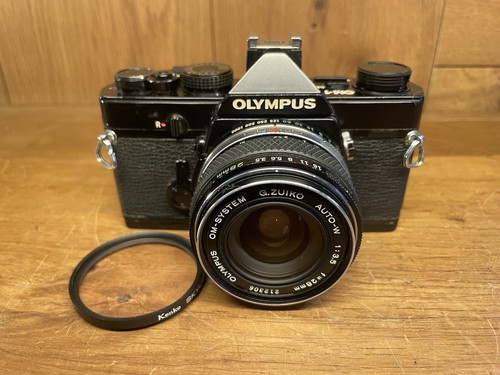 Cla exc olympus om - *cla'd, om-1