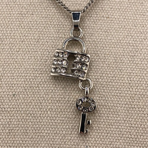 Padlock key pendant - &,