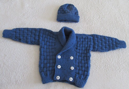 Hand knitted scroll neck