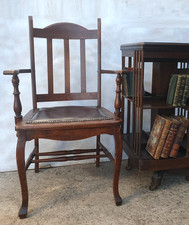 An Arts And Crafts Leather Upholstered  Oak Armchair / Desk Chair