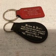 Vintage two leather advertising key rings Collectable 