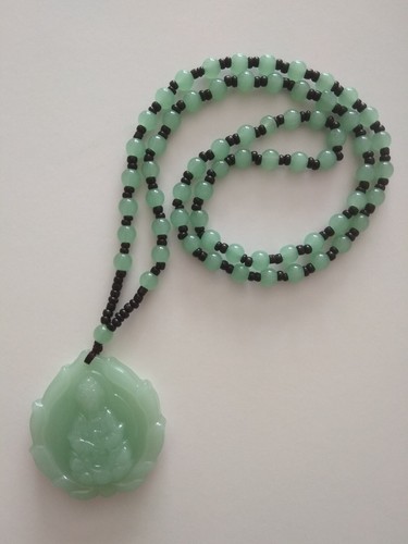Carved light green jade - light,