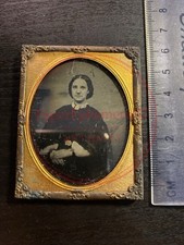 c.1860s ambrotype photograph of a seated woman in ornate brass mat frame