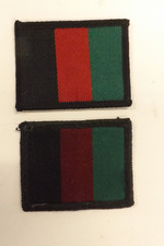 TWO MILITARY CLOTH BADGES 1ST