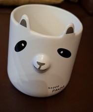 character faced white mug.