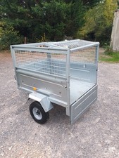 Erde 122 Trailer.  Used but in good condition.  Mesh ext. sides and full cover