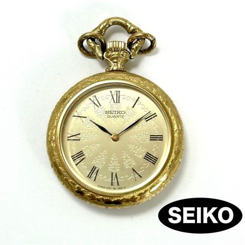 Seiko gold pendant - qz,