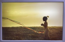 Fine art photography in a Lightbox .... a girl with streamer, sepia tone