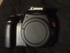 Canon EOS Rebel T3i Digital SLR Camera with three lenses 