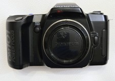 Olympus OM 101 power focus 35mm film camera body with cap. Tested and working.