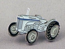 Tractor pin badge. Grey