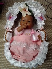 `re born 12 inch ethnic baby doll full body vinyl /silicon in wicker crib