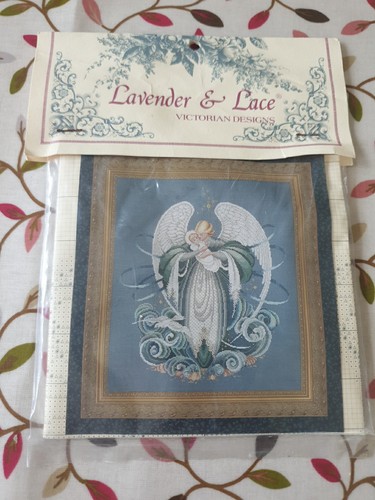 Lavender lace coubted cross - &,