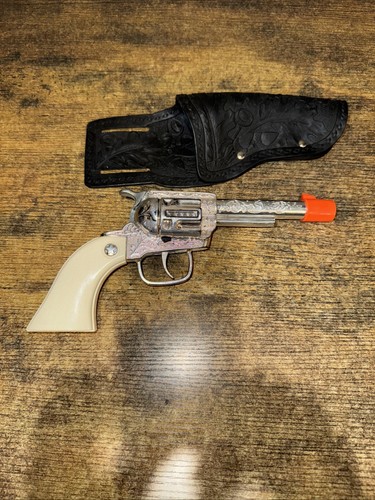 Cap gun brand with orange - with,