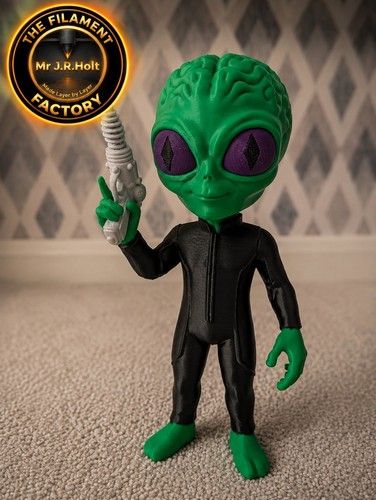 Green alien figurine with - alien, ray