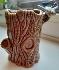 WADE blue bird on a brown tree