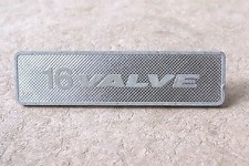 '16 VALVE' METAL CAR BADGE  92x24mm NEW OLD STOCK