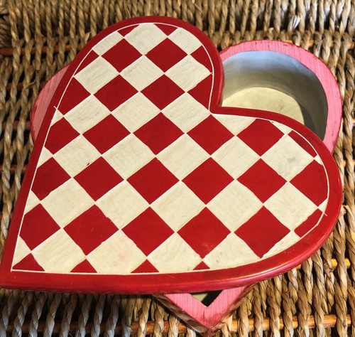 Hand carved and painted red - carved,