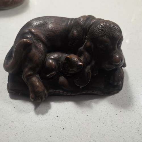 Beautiful carved dog curled - , up