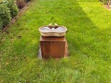 Vintage cast iron cattle feeder