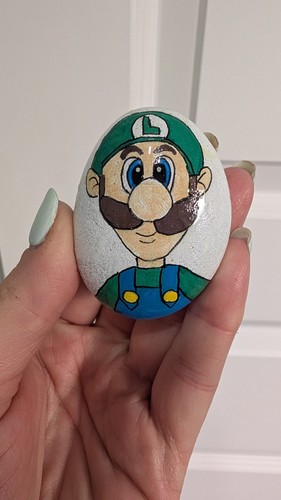 Hand painted pebble luigi - hand,
